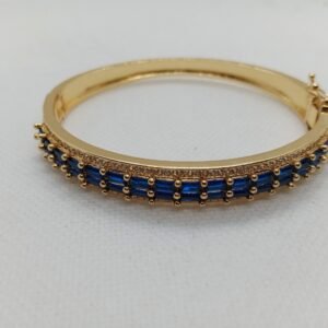 Elegant Gold Bangle with Royal Blue Stones